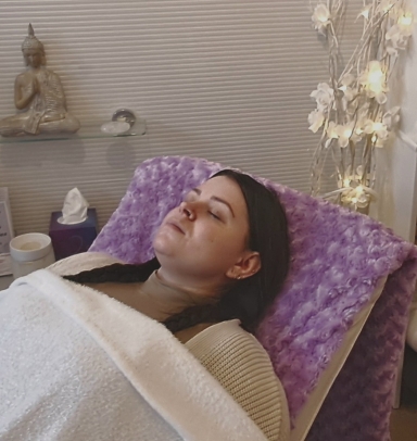Soft focus photograph of a client relaxing in a massage chair
